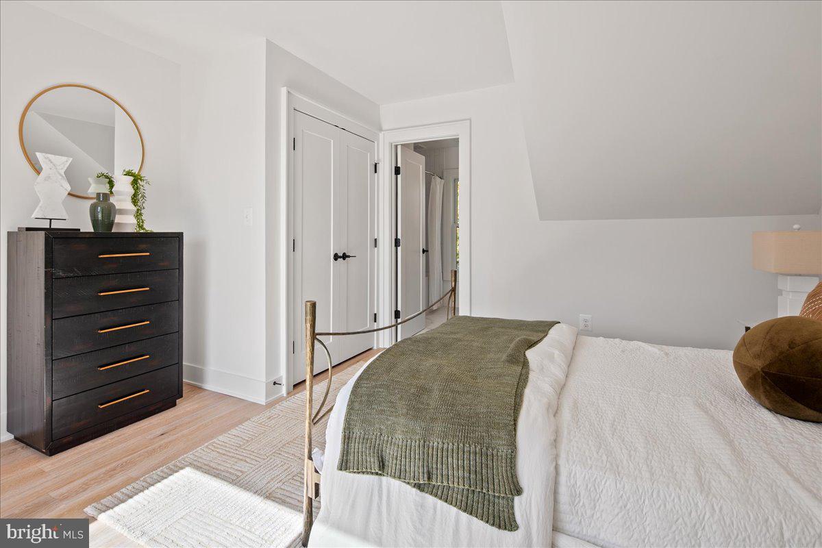 909 North Irving Street Arlington, VA 22201 - Photo 62 of 69 a bedroom with a bed and a dresser