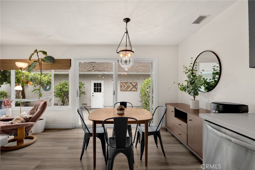 621 Seneca Street Placentia, CA 92870 - Photo 11 of 29 a dining room with furniture a window and a chandelier