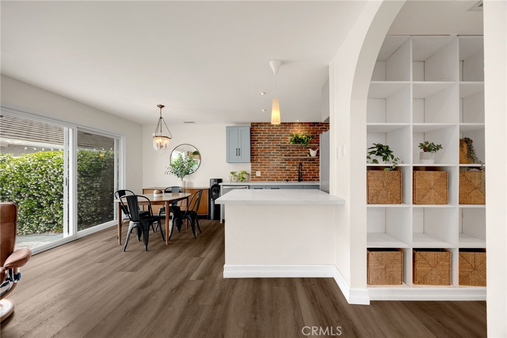 621 Seneca Street Placentia, CA 92870 - Photo 16 of 29 a dining room with wooden floor and large windows