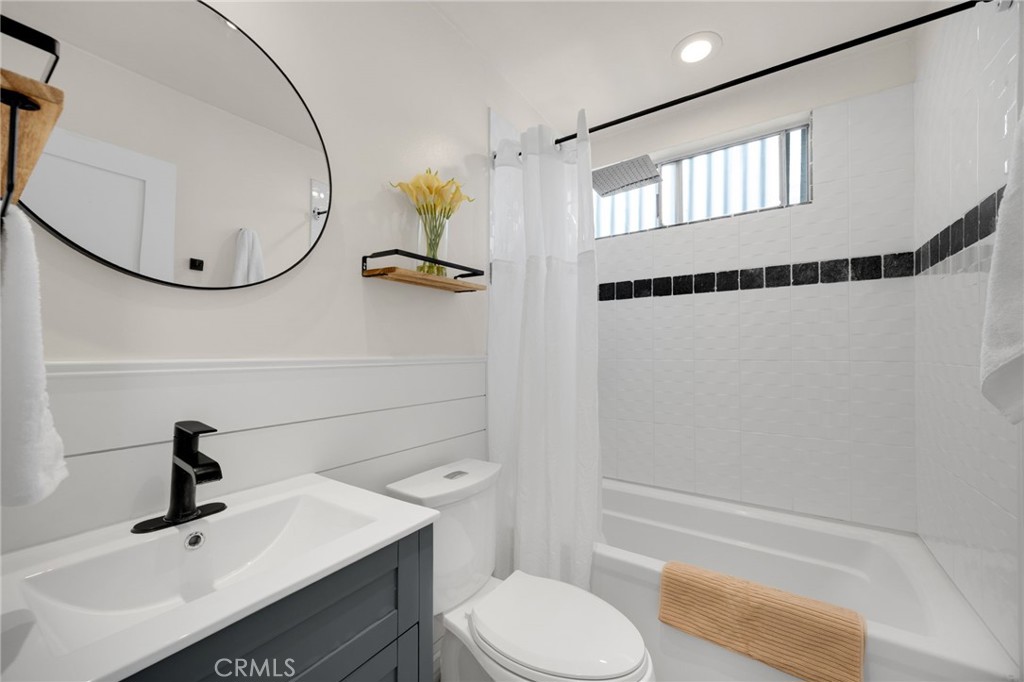 621 Seneca Street Placentia, CA 92870 - Photo 20 of 29 a bathroom with a sink a toilet and a mirror