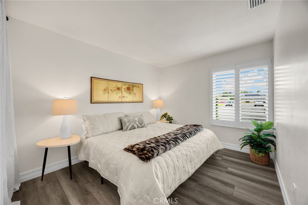 621 Seneca Street Placentia, CA 92870 - Photo 23 of 29 a bedroom with a bed painting on wall and a potted plant