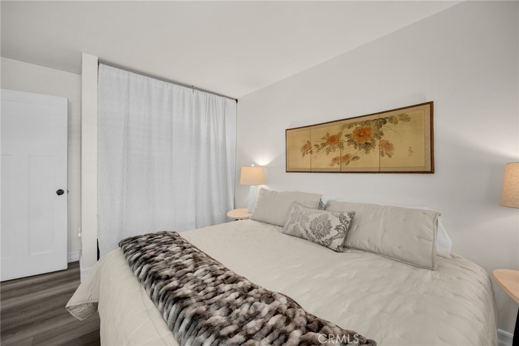 621 Seneca Street Placentia, CA 92870 - Photo 24 of 29 a bedroom with a bed and a painting on the wall