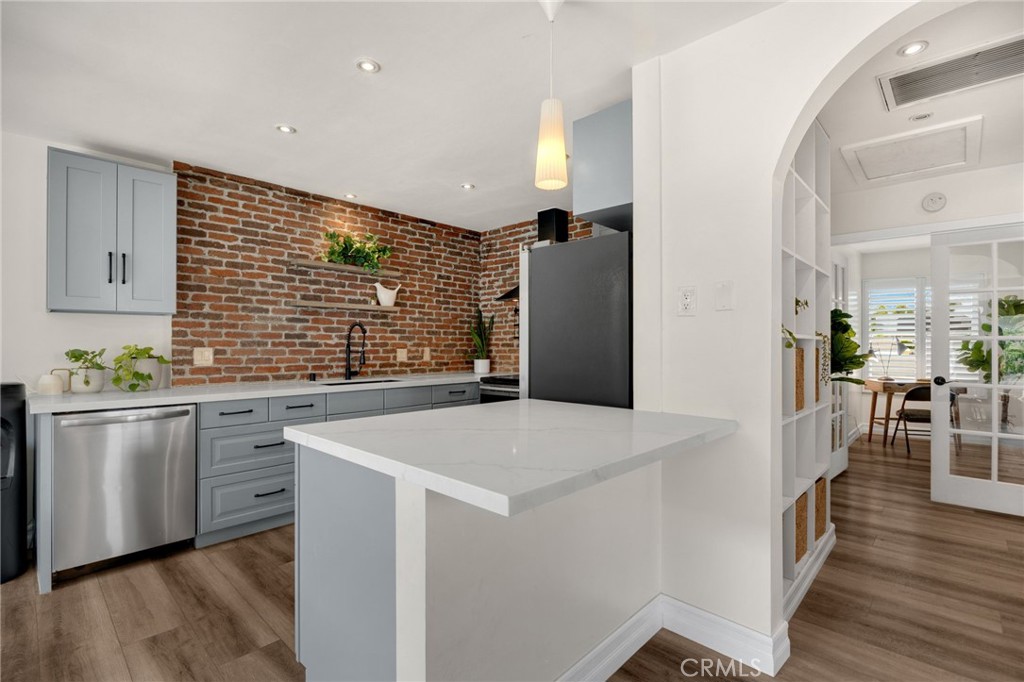 621 Seneca Street Placentia, CA 92870 - Photo 6 of 29 a kitchen with stainless steel appliances a refrigerator and a stove top oven