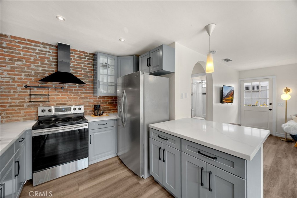 621 Seneca Street Placentia, CA 92870 - Photo 8 of 29 a kitchen with stainless steel appliances granite countertop a stove a refrigerator and a sink