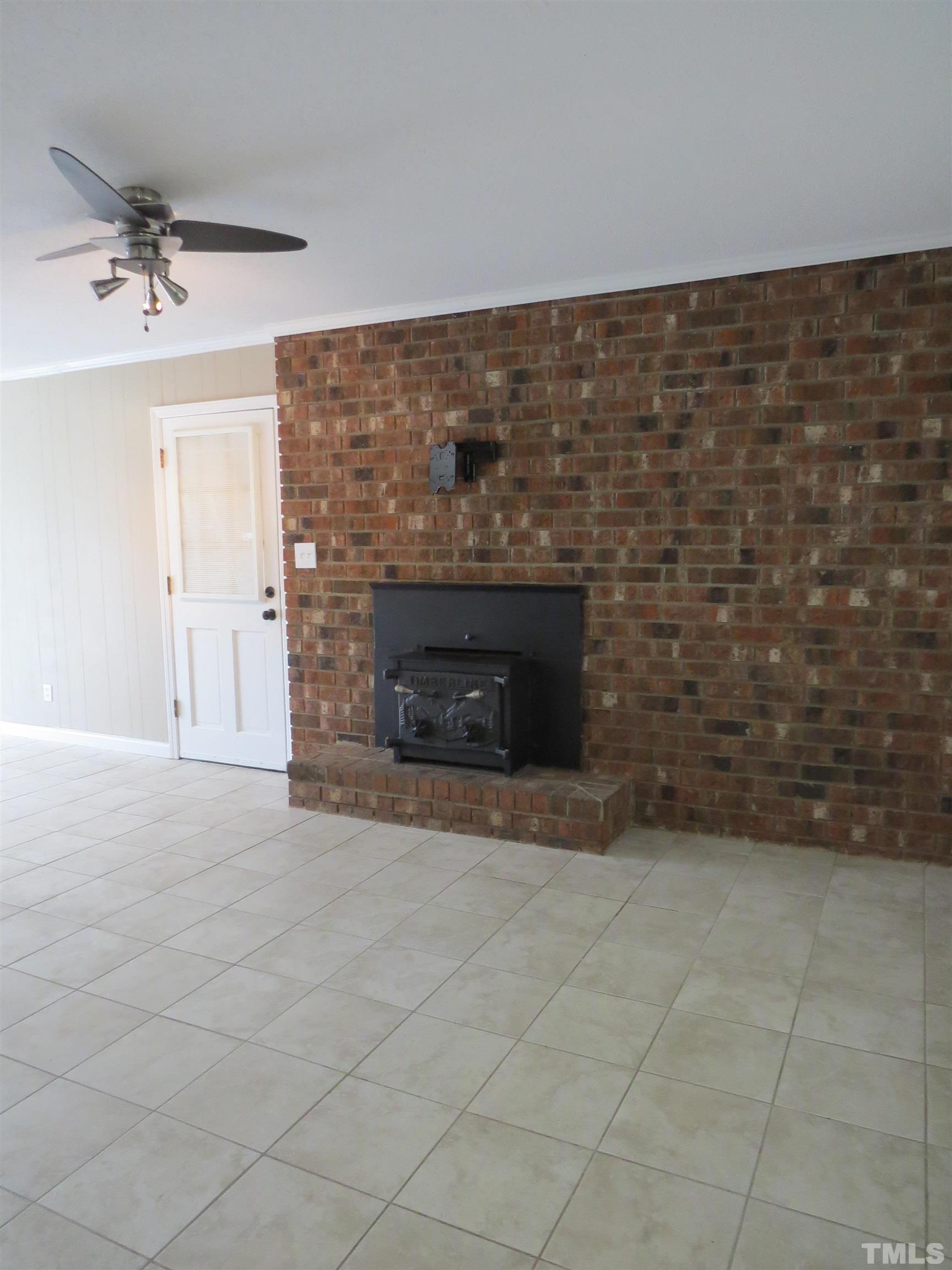 2845 Carson Gregory Road Angier, NC 27501 - Photo 28 of 42 a view of empty room with a fireplace