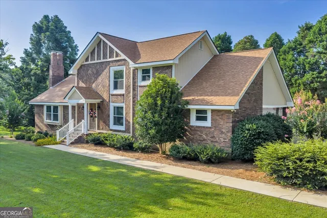 a front view of a house with a yard