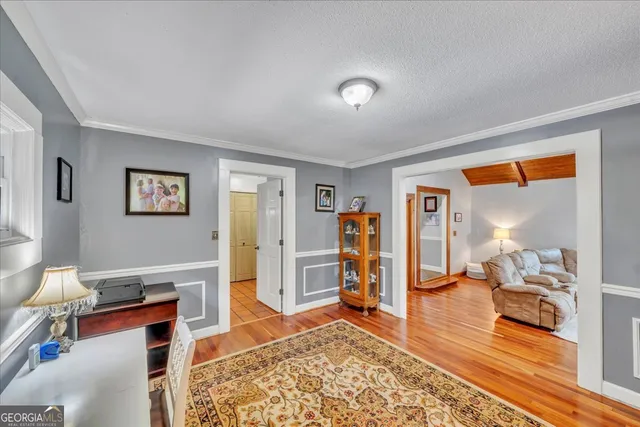 a living room with furniture and a table
