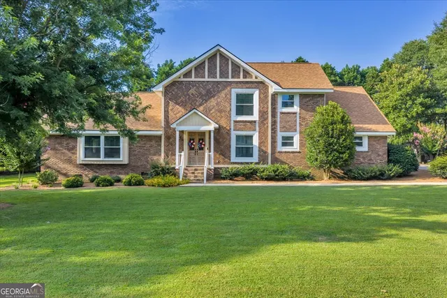 a front view of a house with a yard
