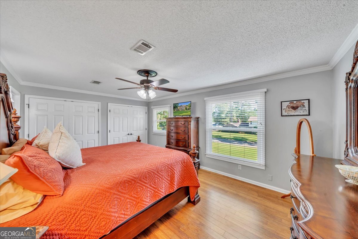 1808 Ross Street Perry, GA 31069 - Photo 26 of 56 a bedroom with a bed and a large window with the outer view