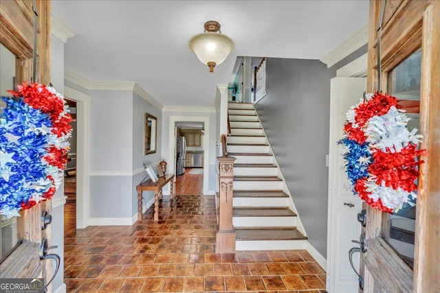 a view of entryway with flower pots