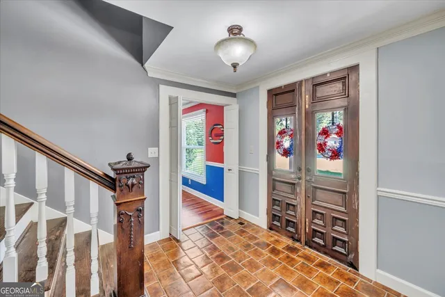 a front view of a house with swimming pool having outdoor seating