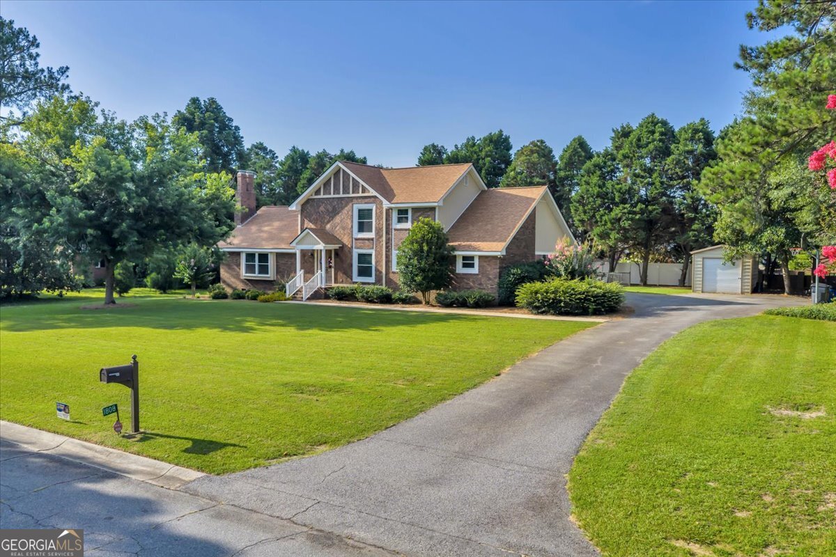 1808 Ross Street Perry, GA 31069 - Photo 42 of 56 a front view of a house with swimming pool having outdoor seating