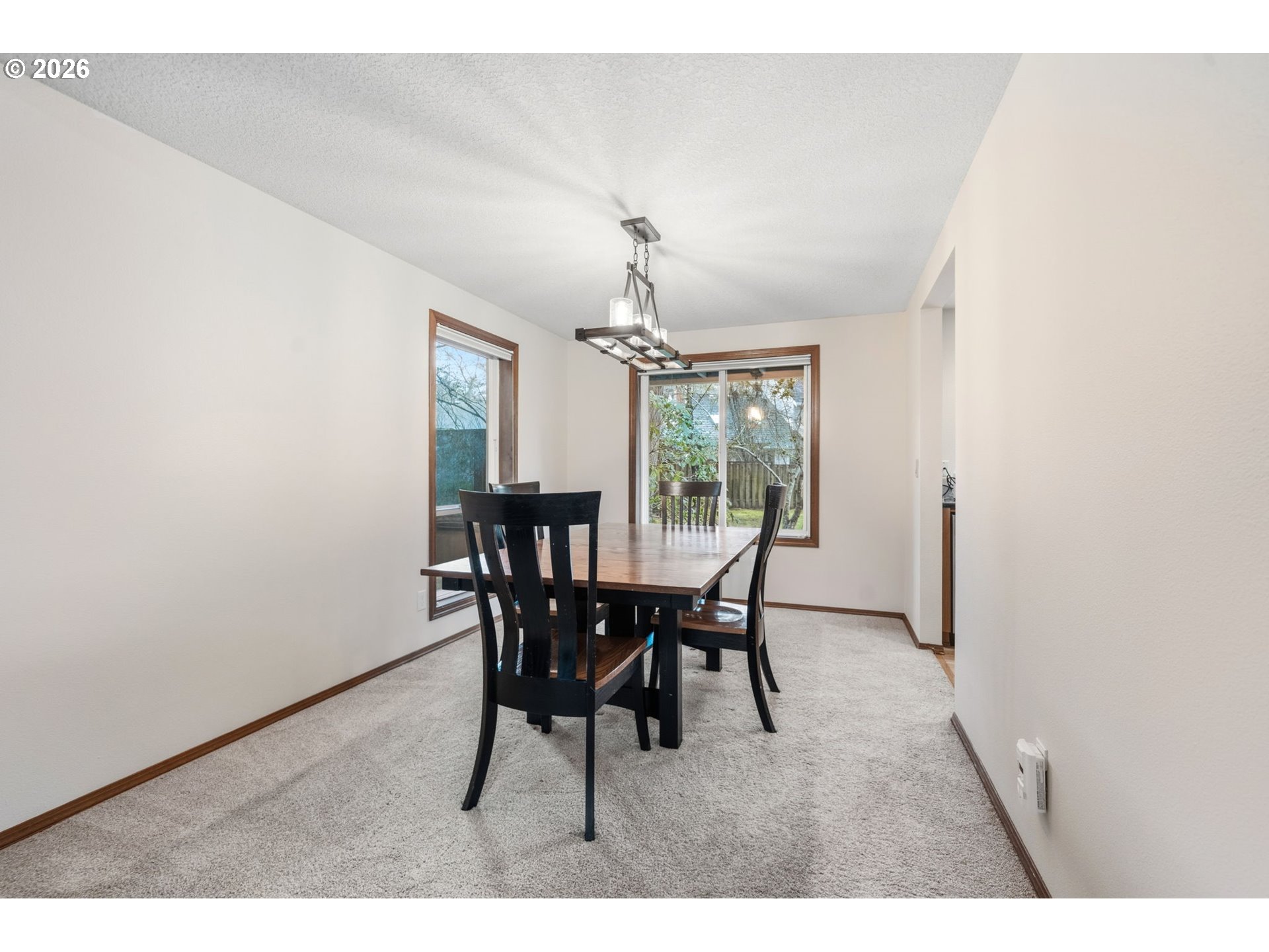 13825 Southwest Weir Road Beaverton, OR 97008 - Photo 13 of 40 a view of a dining room with furniture and window