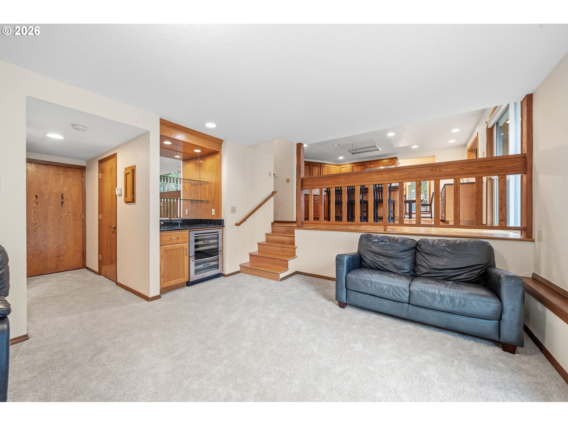 13825 Southwest Weir Road Beaverton, OR 97008 - Photo 26 of 40 a living room with furniture and stairs