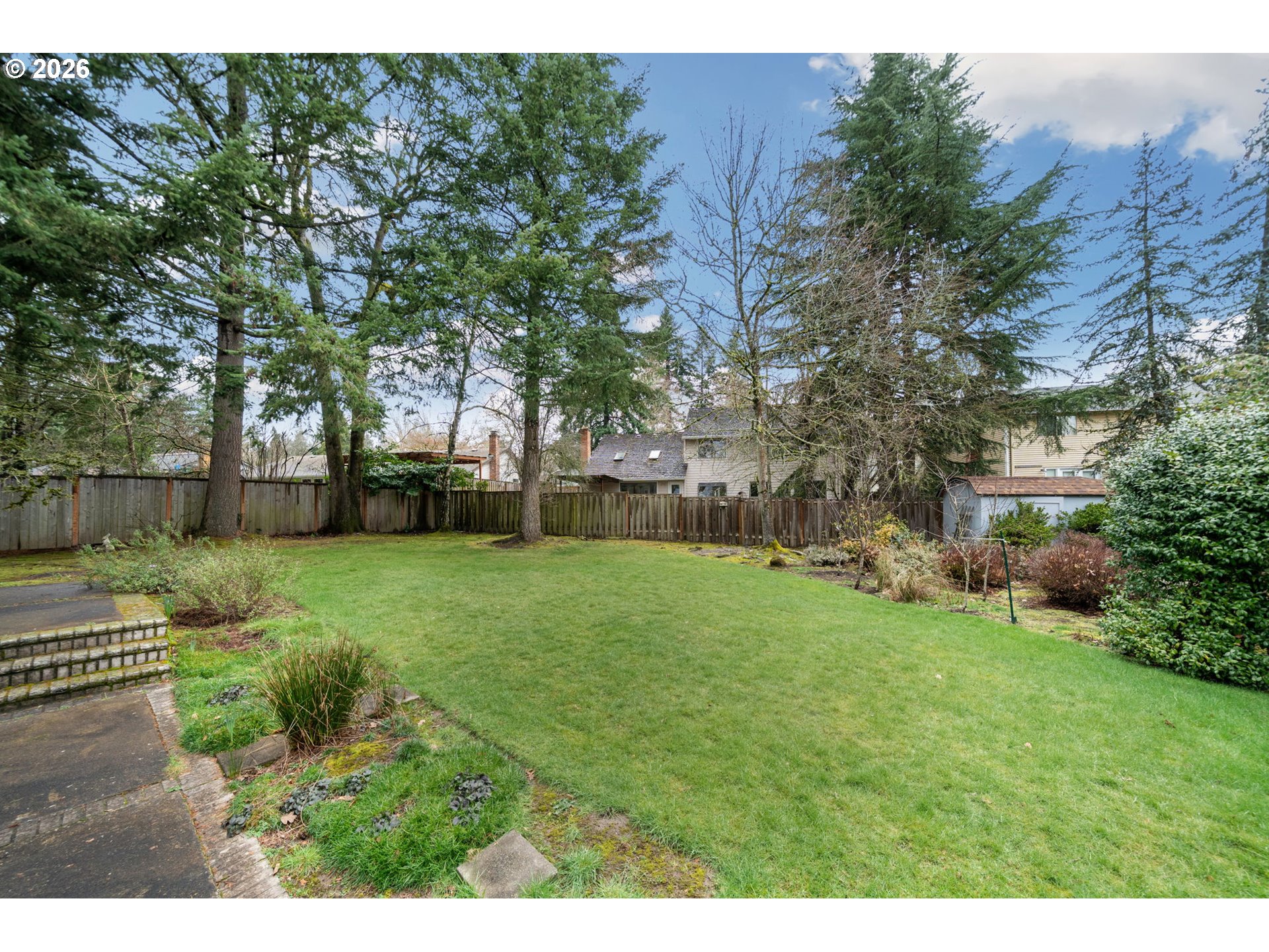 13825 Southwest Weir Road Beaverton, OR 97008 - Photo 29 of 40 a view of a backyard with large trees