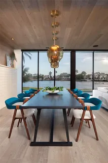 a large white kitchen with a large window