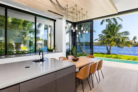 a room with furniture projector and screen