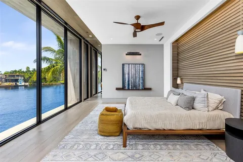 a bedroom with a large bed and a window