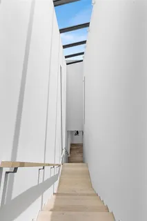 a spacious bathroom with a double vanity sink and a bathtub