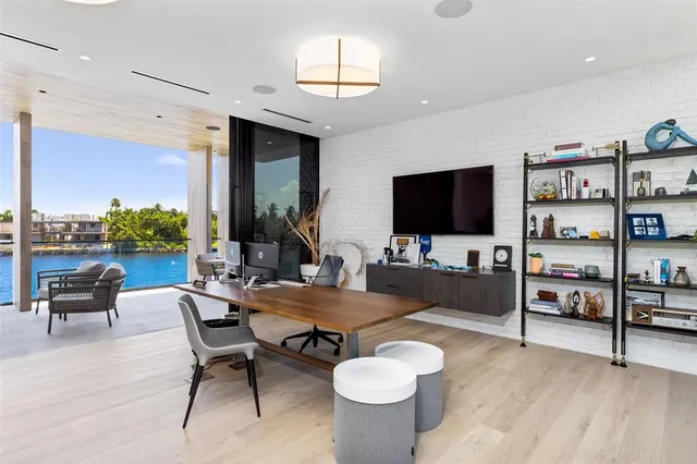 a bathroom with a tub mirror and toilet