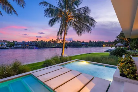 a view of swimming pool with lounge chair