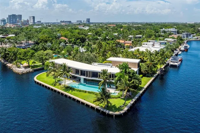 an aerial view of city and lake