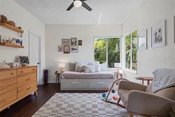 a aerial view of a house with a yard and potted plants