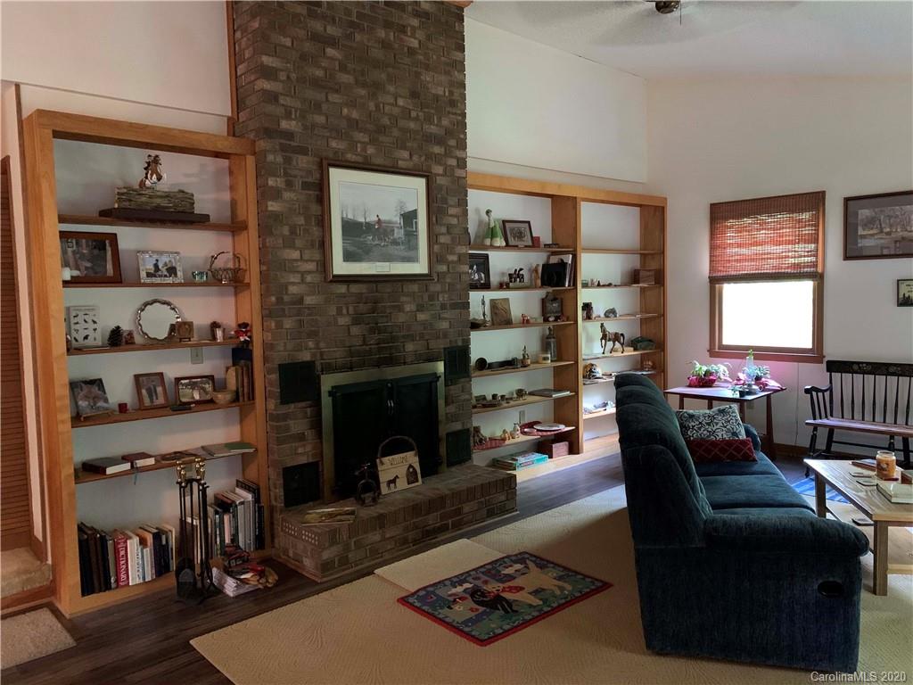 1387 Peniel Road Columbus, NC 28722 - Photo 5 of 5 a living room with furniture and a fireplace