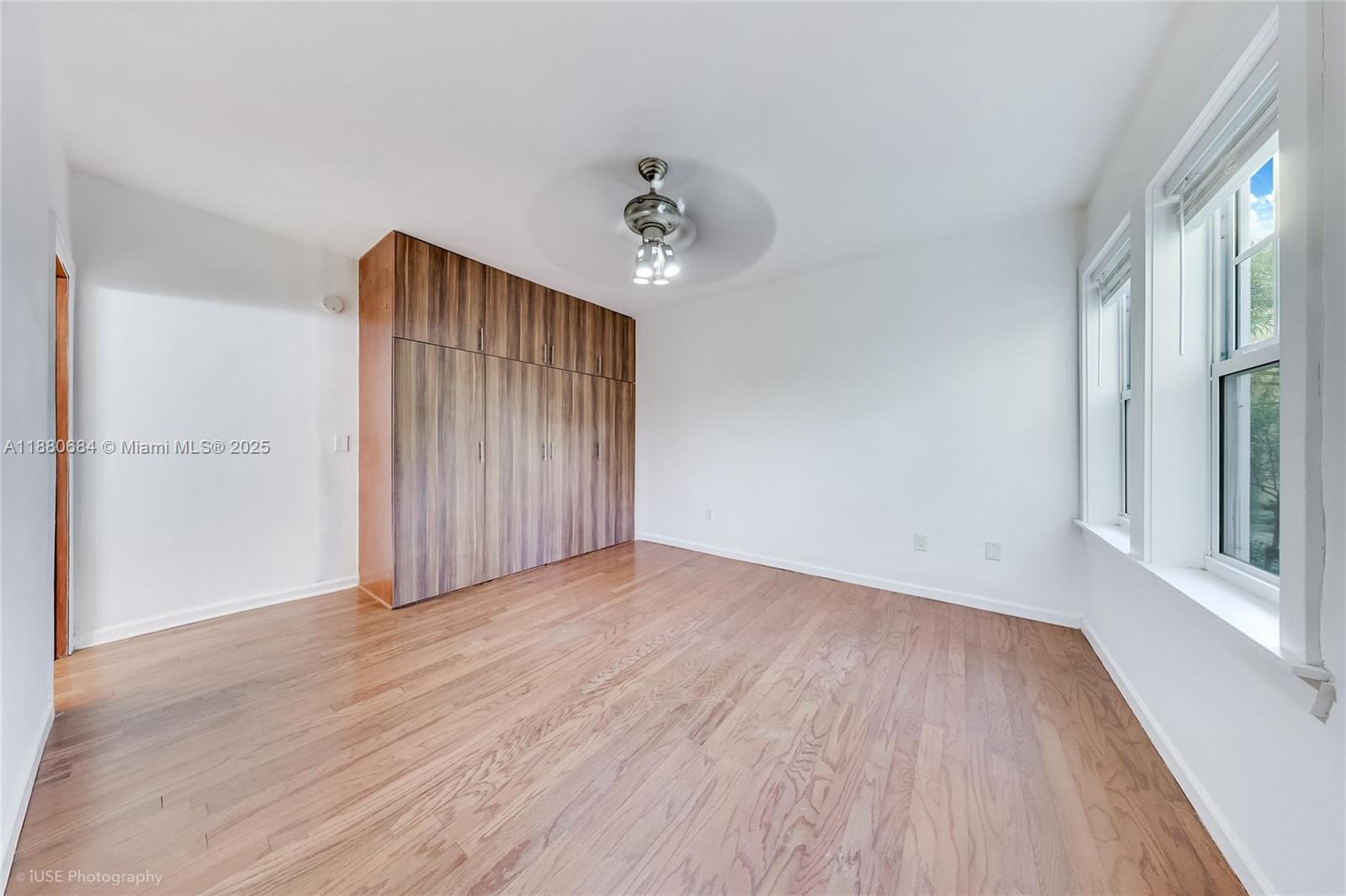 536 14th Street, Unit 110 Miami Beach, FL 33139 - Photo 11 of 15 wooden floor in an empty room with a window