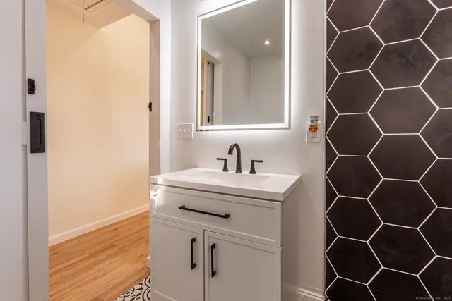a bathroom with a sink and mirror