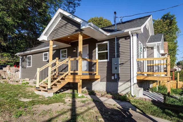 a front view of a house with yard