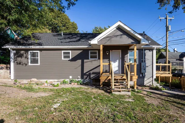 front view of a house with a yard