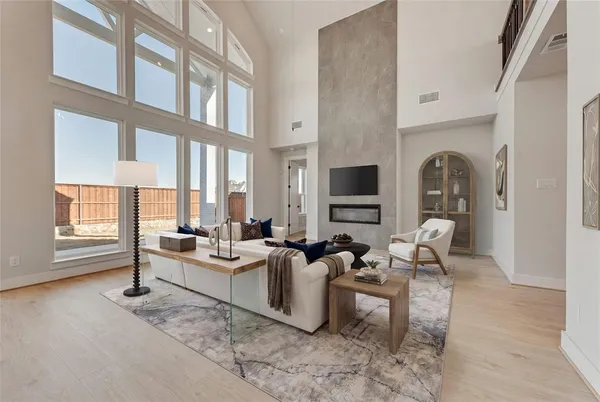a living room with furniture fireplace and flat screen tv