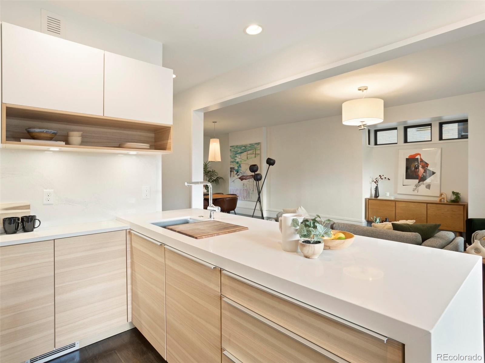1253 Elizabeth Street Denver, CO 80206 - Photo 16 of 49 a kitchen with cabinets appliances and a counter top space