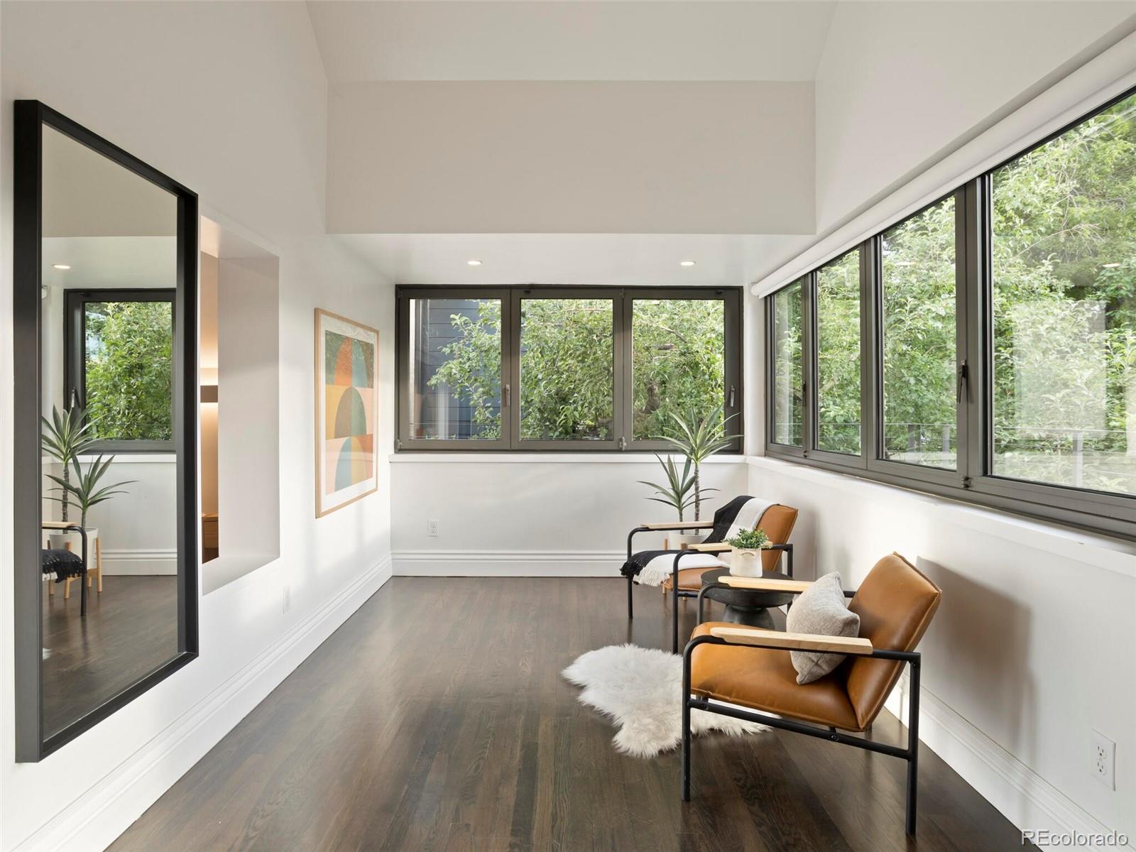 1253 Elizabeth Street Denver, CO 80206 - Photo 24 of 49 a living room with furniture and a large window