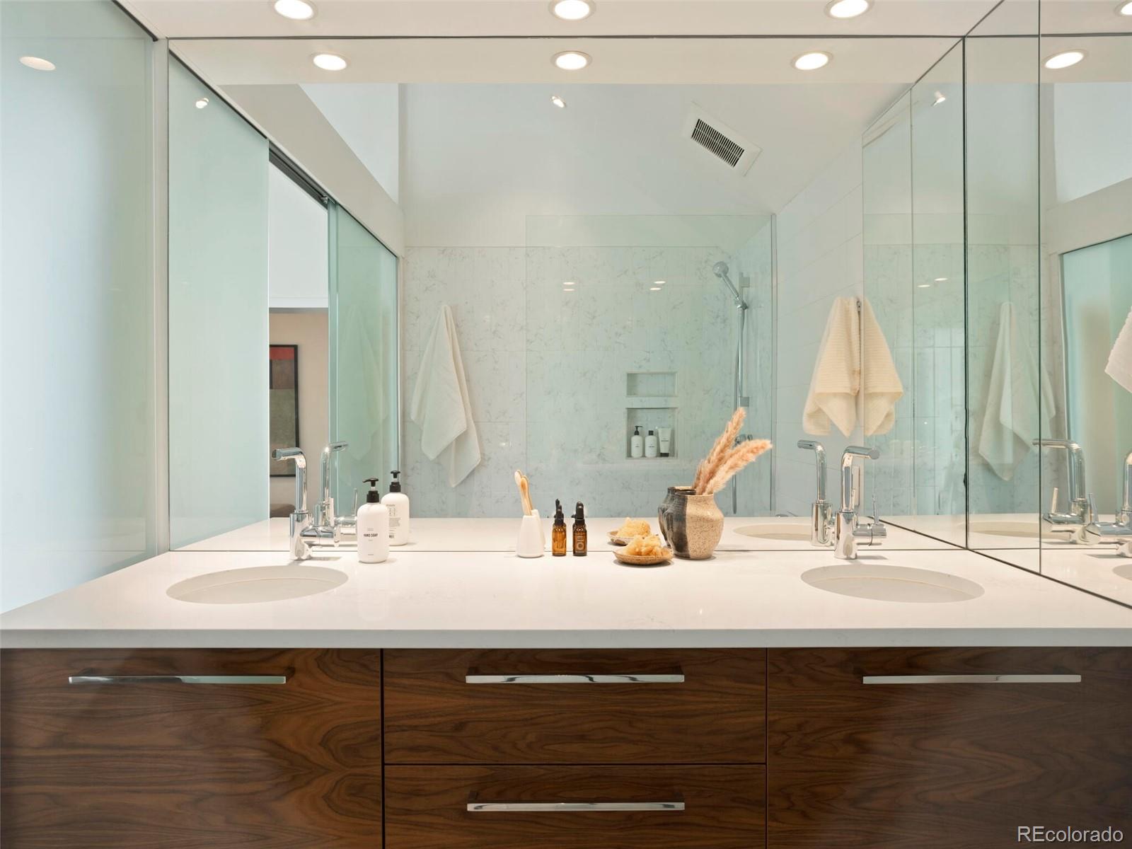 1253 Elizabeth Street Denver, CO 80206 - Photo 29 of 49 a bathroom with a sink and a mirror