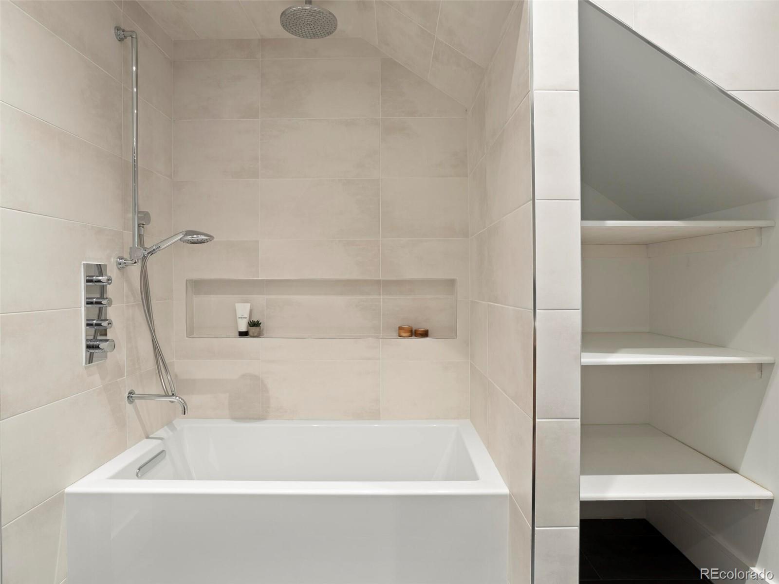 1253 Elizabeth Street Denver, CO 80206 - Photo 34 of 49 a bathroom with bathtub