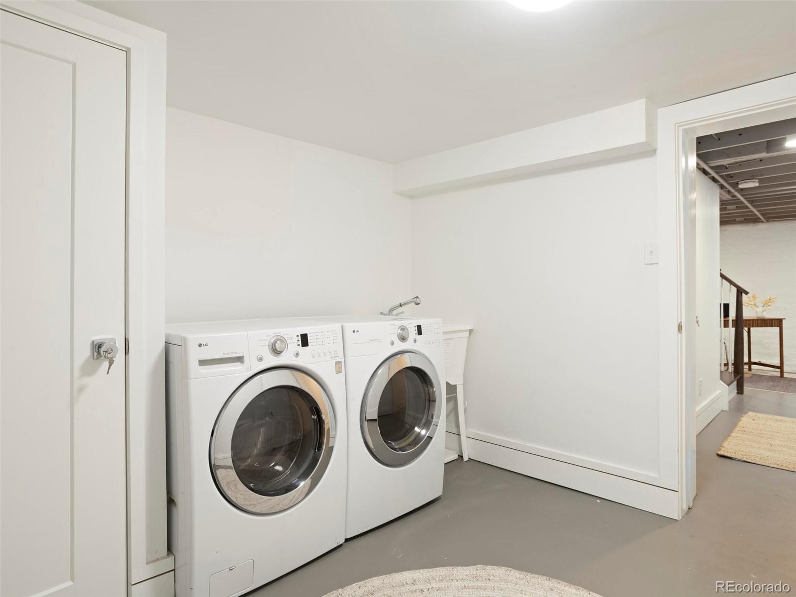 1253 Elizabeth Street Denver, CO 80206 - Photo 37 of 49 a utility room with dryer and washer