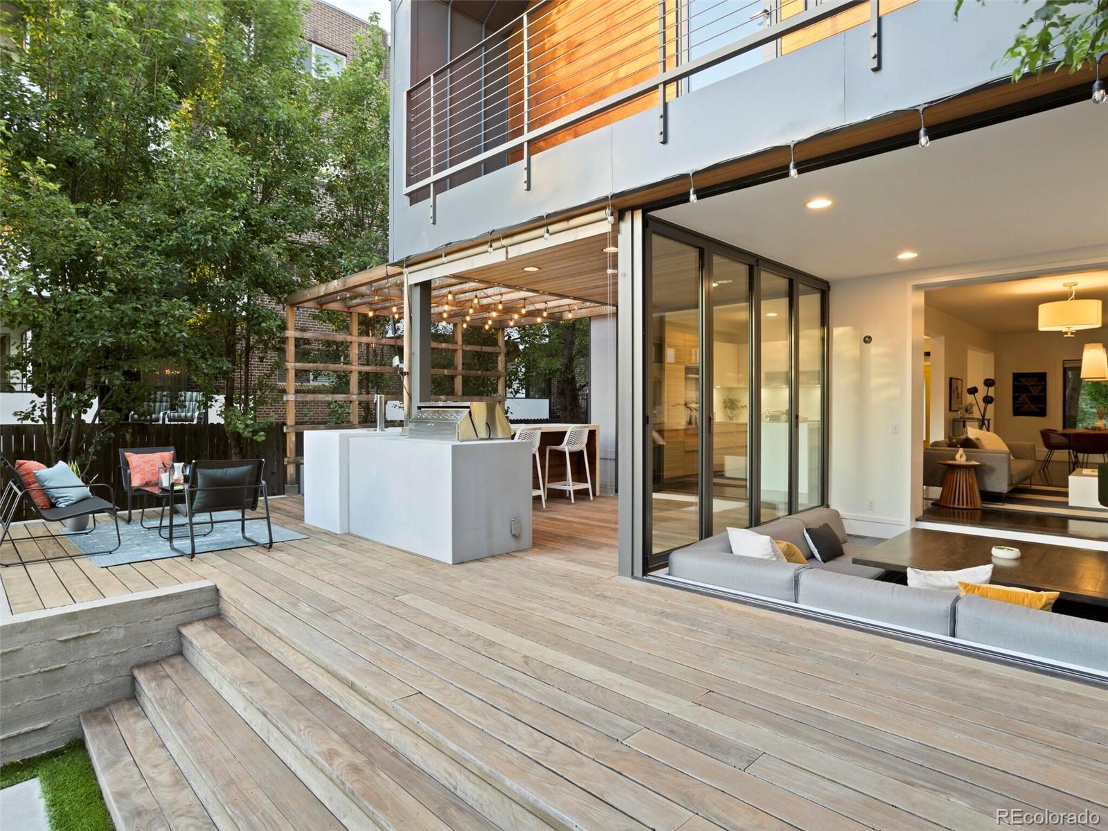 1253 Elizabeth Street Denver, CO 80206 - Photo 39 of 49 a view of a patio with a table and chairs and potted plants
