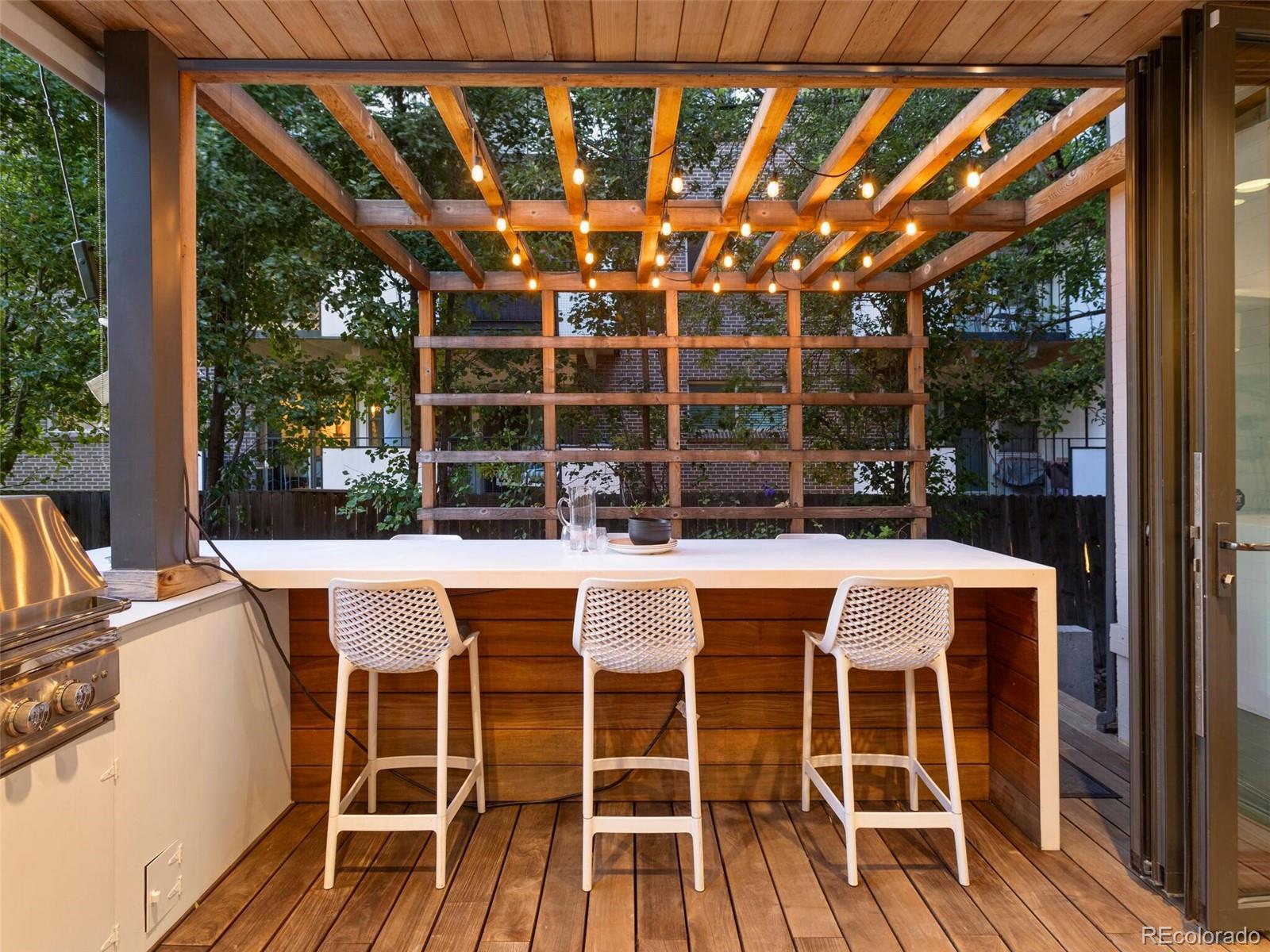 1253 Elizabeth Street Denver, CO 80206 - Photo 45 of 49 a patio with table and chairs