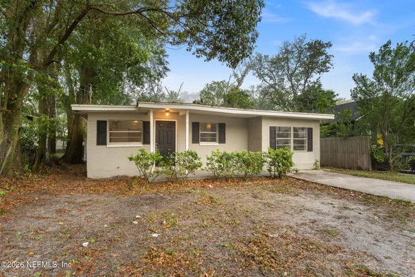 front view of a house with a yard
