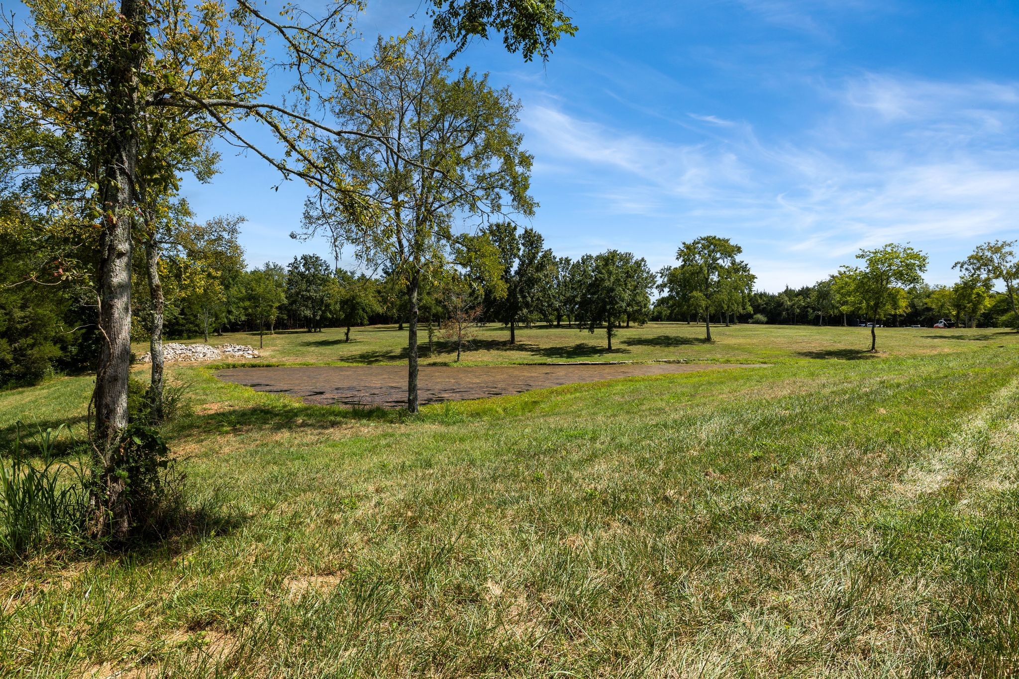 8362 Patterson Road College Grove, TN 37046 - Photo 8 of 27 a view of a golf course with a lake
