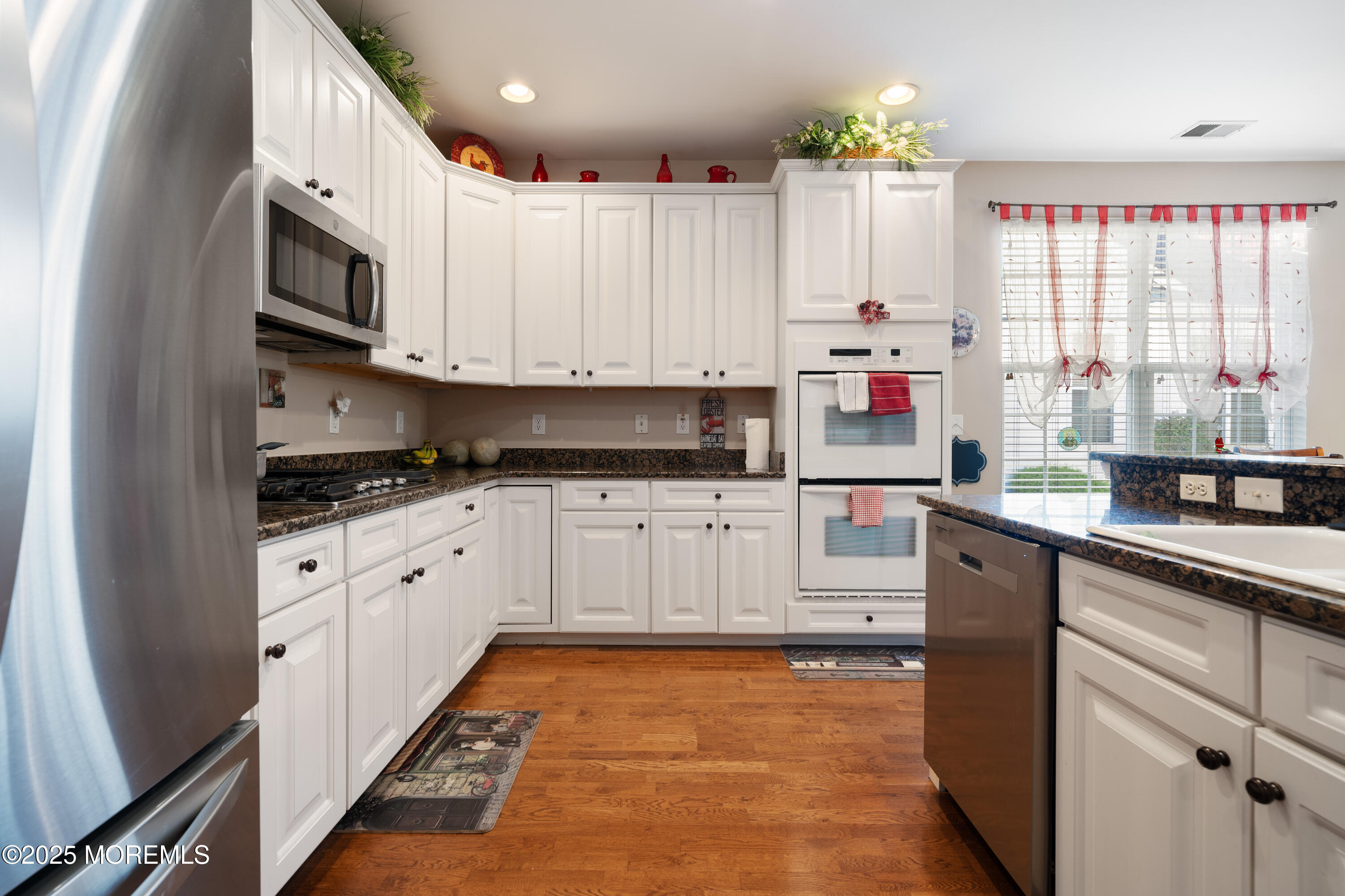 24 Pond View Circle Barnegat, NJ 08005 - Photo 11 of 50 a kitchen with granite countertop white cabinets and white appliances