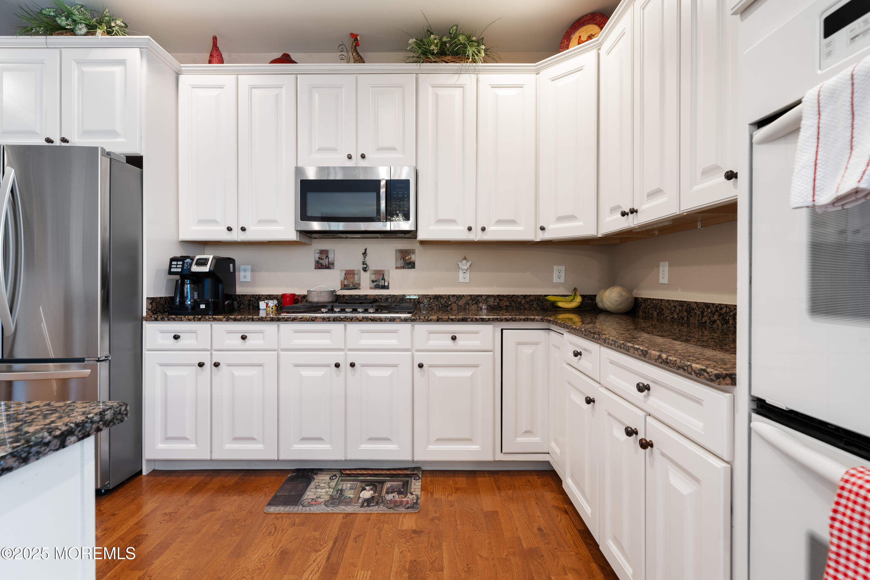 24 Pond View Circle Barnegat, NJ 08005 - Photo 12 of 50 a kitchen with stainless steel appliances white cabinets and a refrigerator