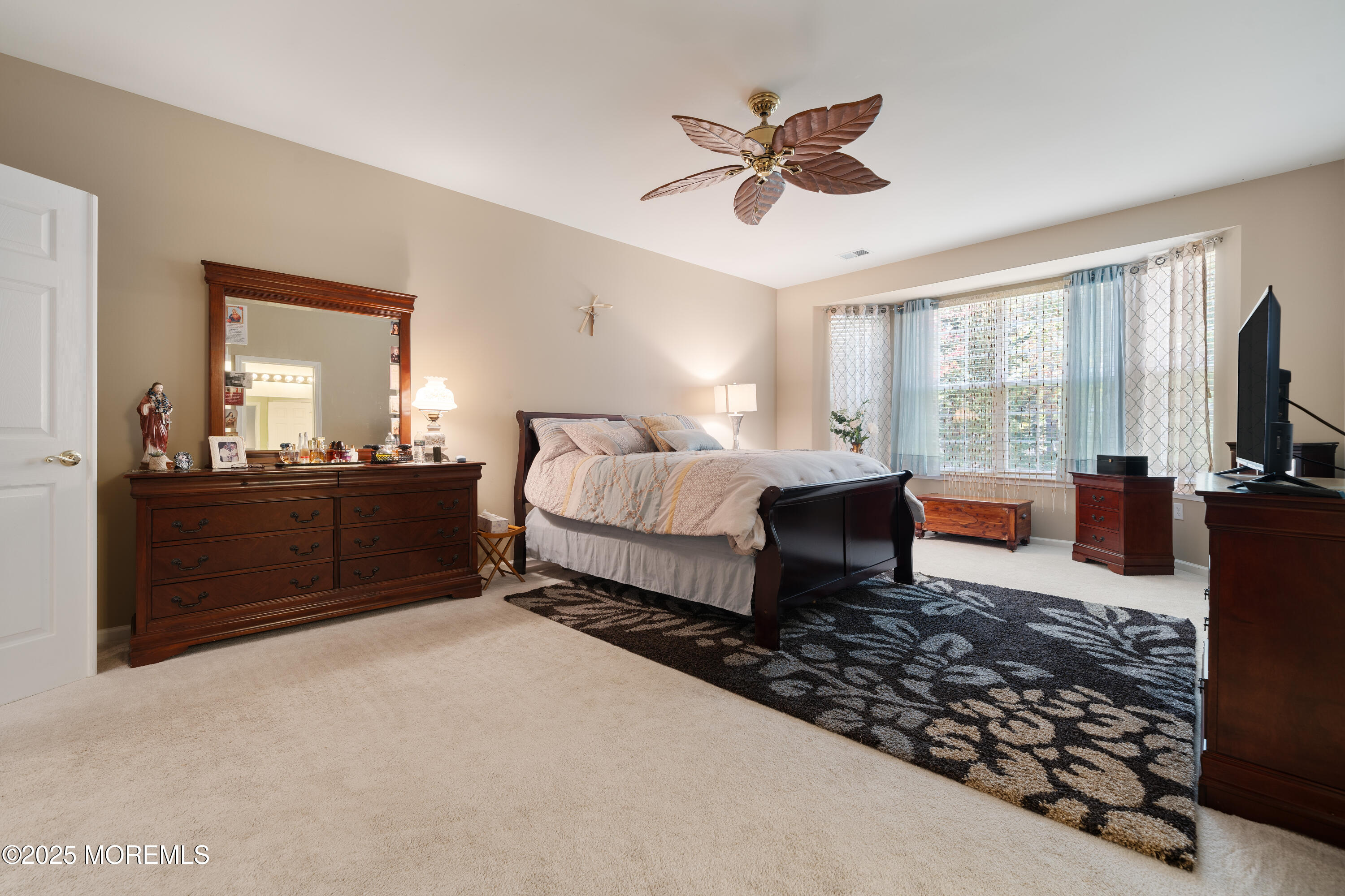24 Pond View Circle Barnegat, NJ 08005 - Photo 23 of 50 a living room with a bed furniture flat screen tv and windows