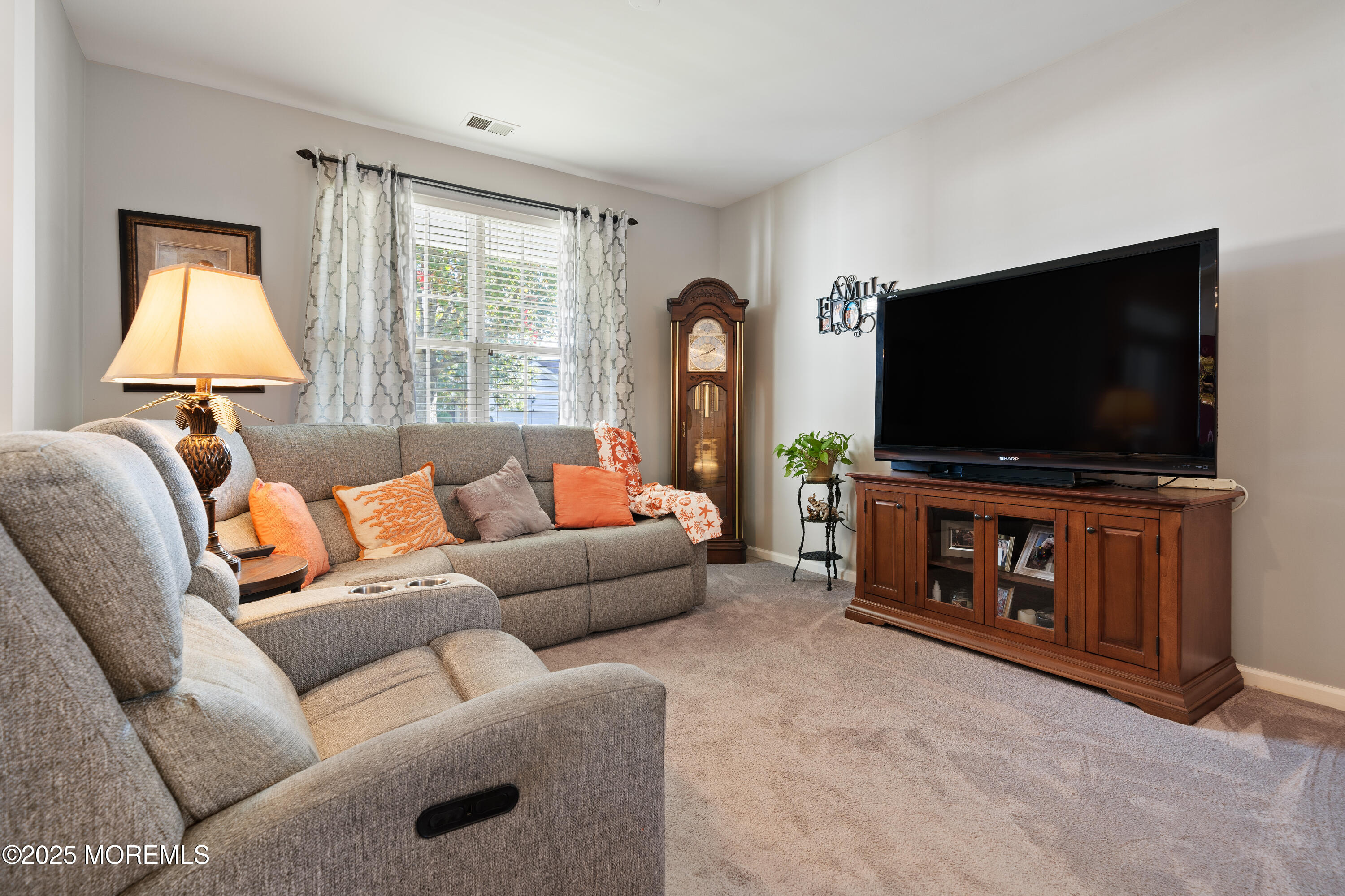 24 Pond View Circle Barnegat, NJ 08005 - Photo 7 of 50 a living room with furniture and a flat screen tv