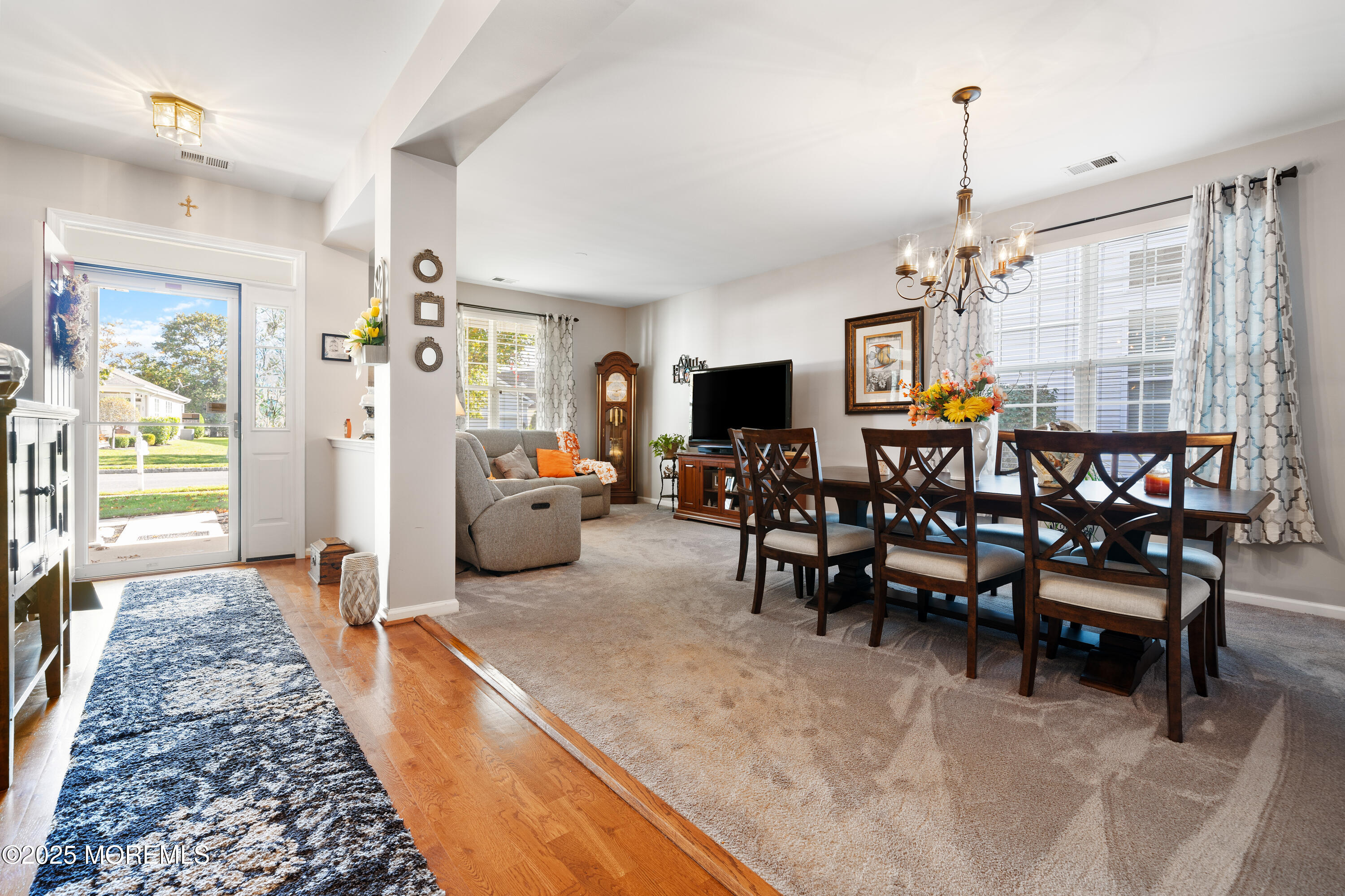 24 Pond View Circle Barnegat, NJ 08005 - Photo 9 of 50 a living room with furniture and a chandelier