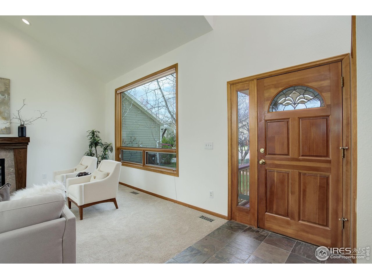 4462 Wellington Road Boulder, CO 80301 - Photo 11 of 37 a living room with furniture and a painting on the wall
