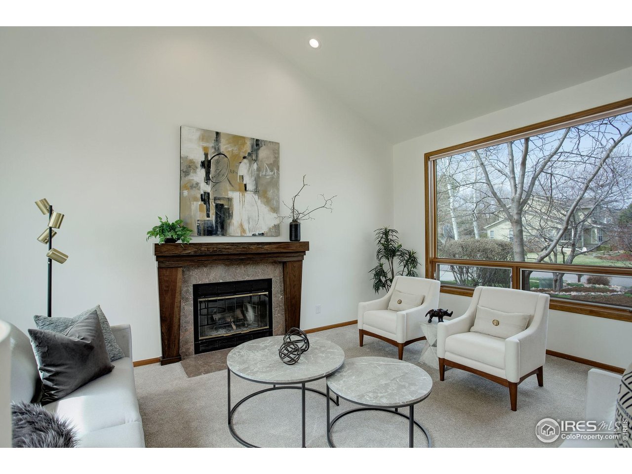 4462 Wellington Road Boulder, CO 80301 - Photo 12 of 37 a living room with furniture and a fireplace