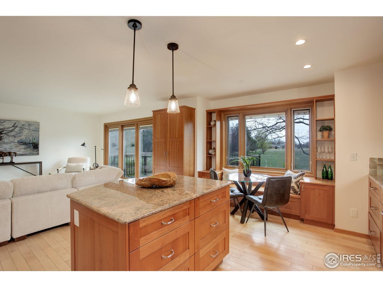 4462 Wellington Road Boulder, CO 80301 - Photo 15 of 37 a living room with furniture a large window and a chandelier